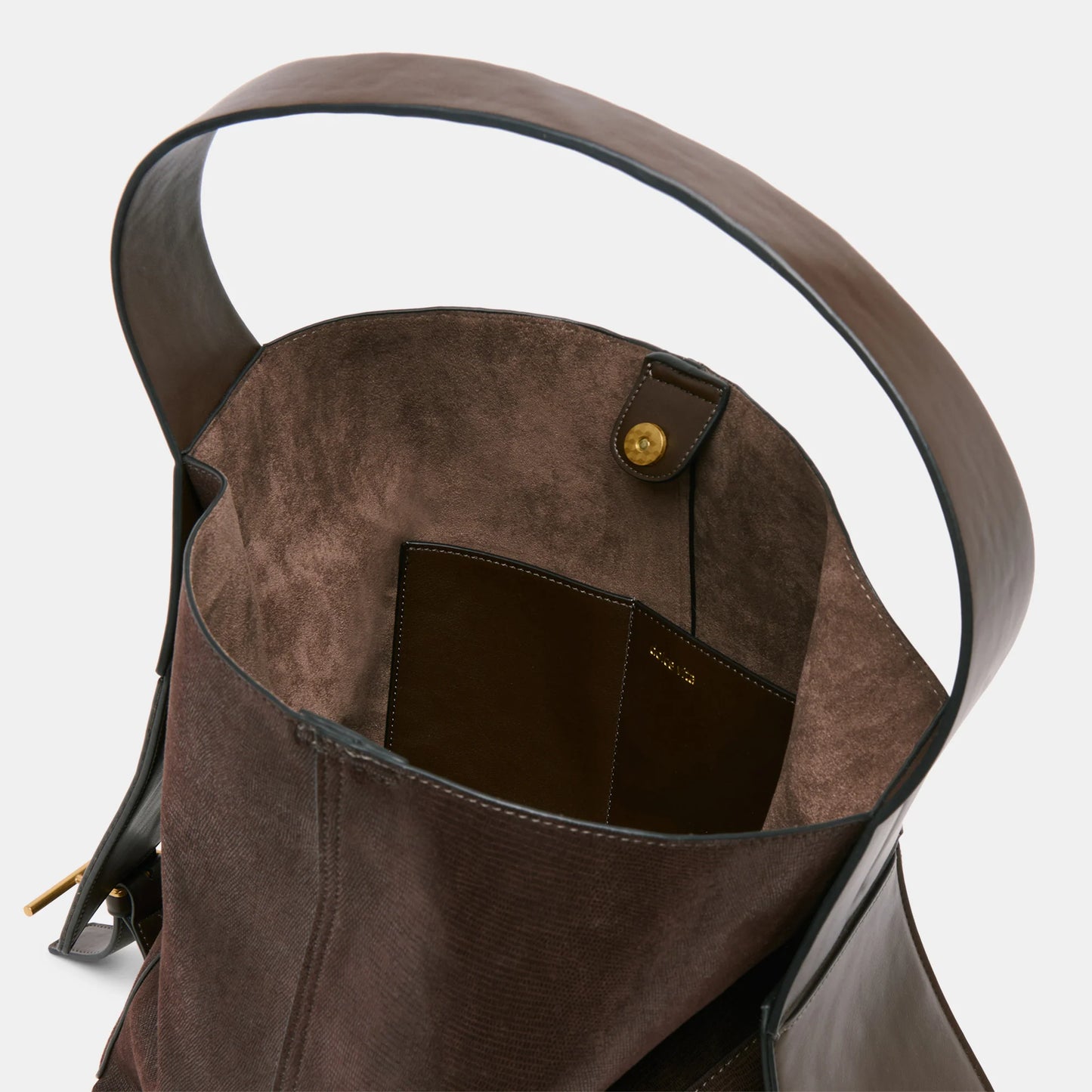 Dolce Vita shoulder bag with buckled side flaps and sleek stitched silhouette