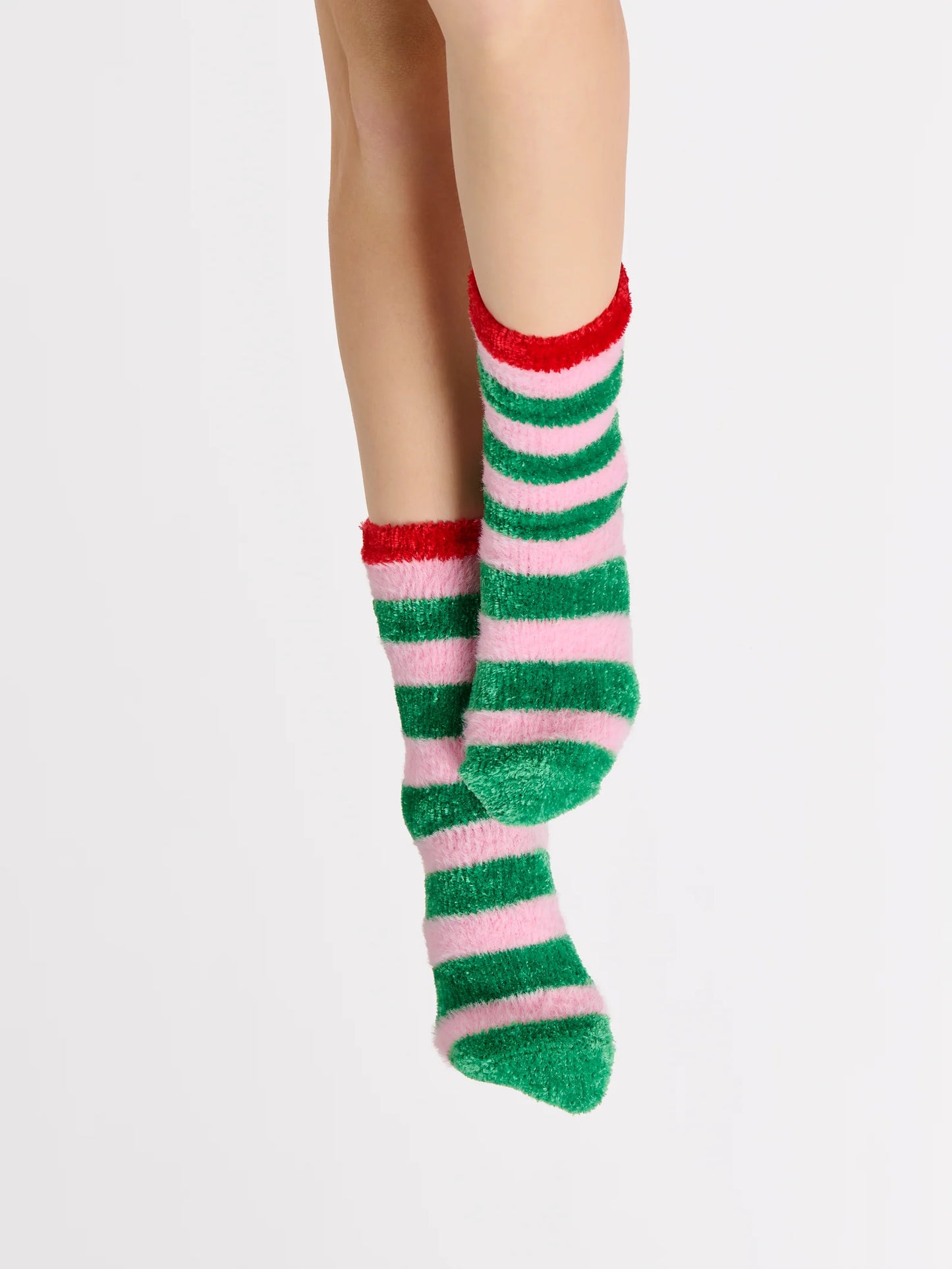 Jolly Socks in festive holiday colors with fuzzy fabric and rubber grip bottoms