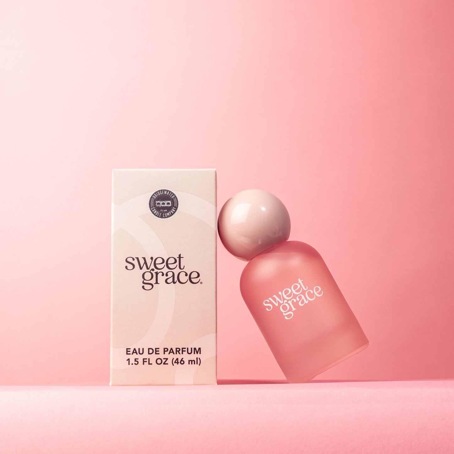 Sweet Grace perfume in frosted pink bottle with glossy pink ball top