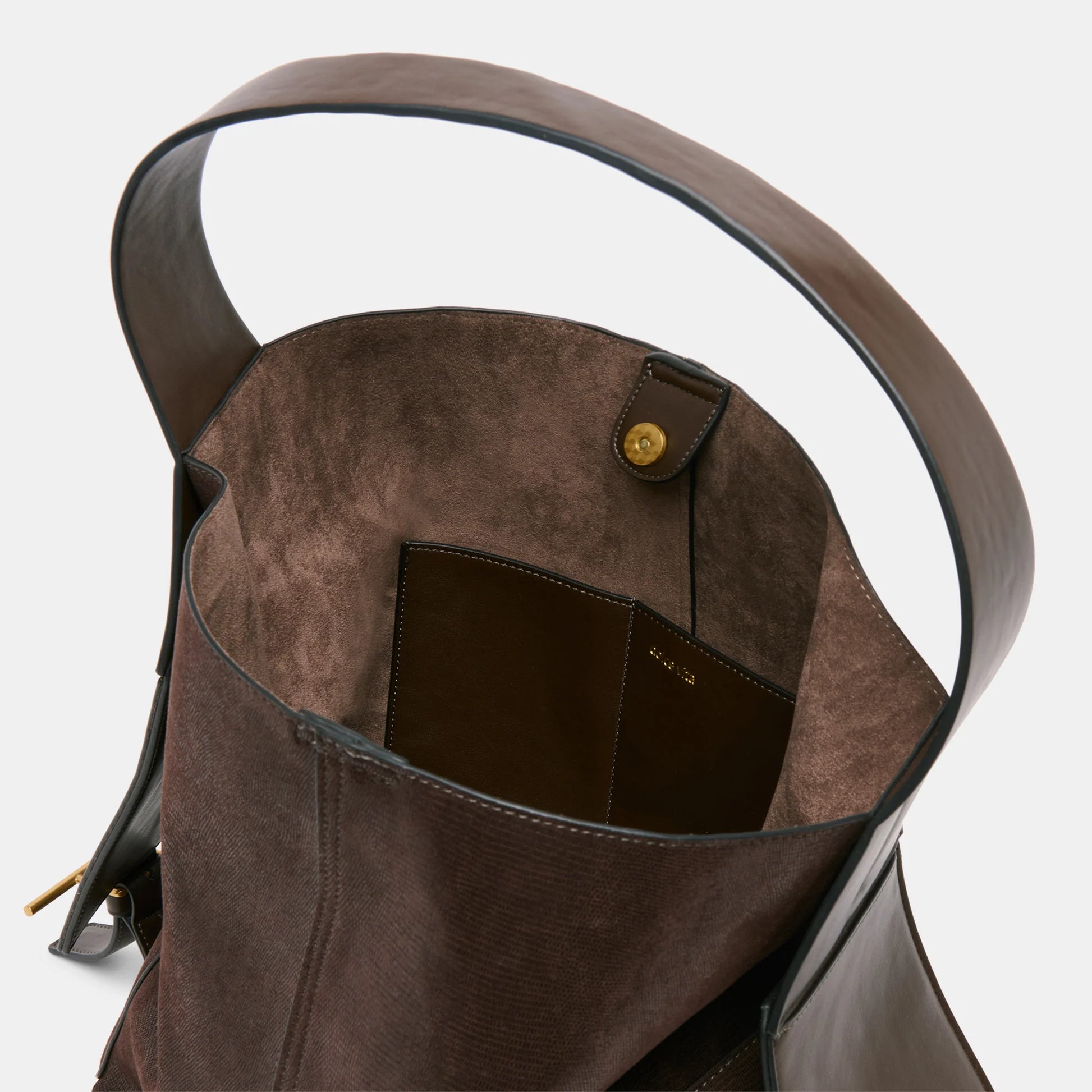 Dolce Vita shoulder bag with buckled side flaps and sleek stitched silhouette