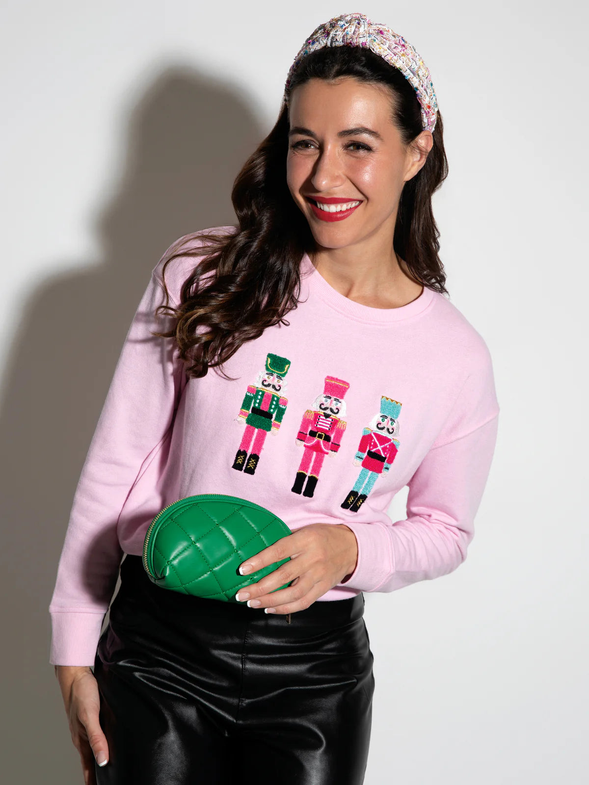 Shiraleah Nutcracker pink sweatshirt with embroidered nutcracker icons