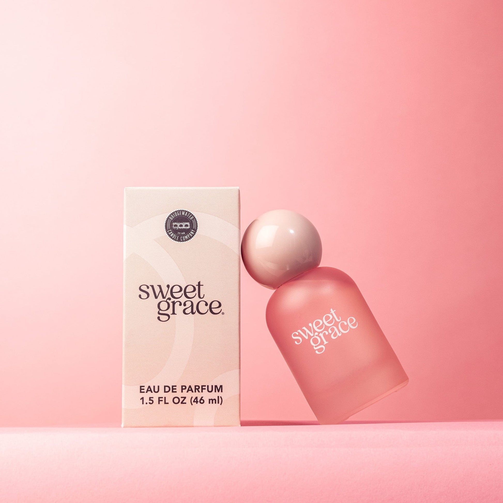 Sweet Grace perfume in frosted pink bottle with glossy pink ball top