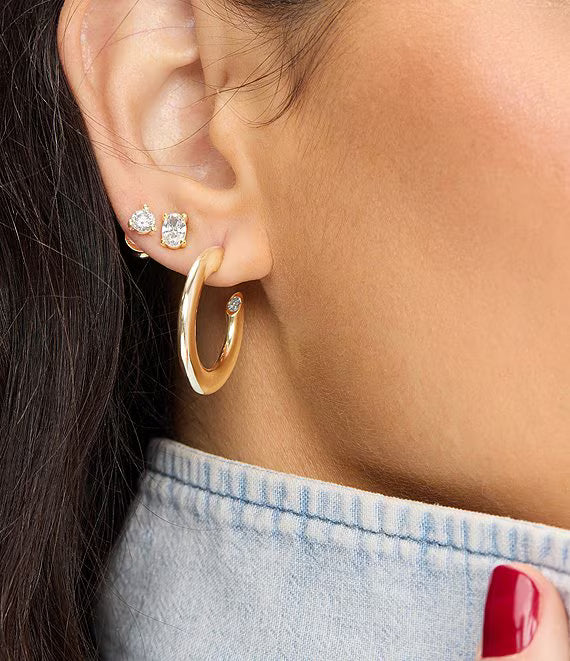 Melinda Maria Beacon hoop earrings with sculpted curve and stone detail 1 inch diameter